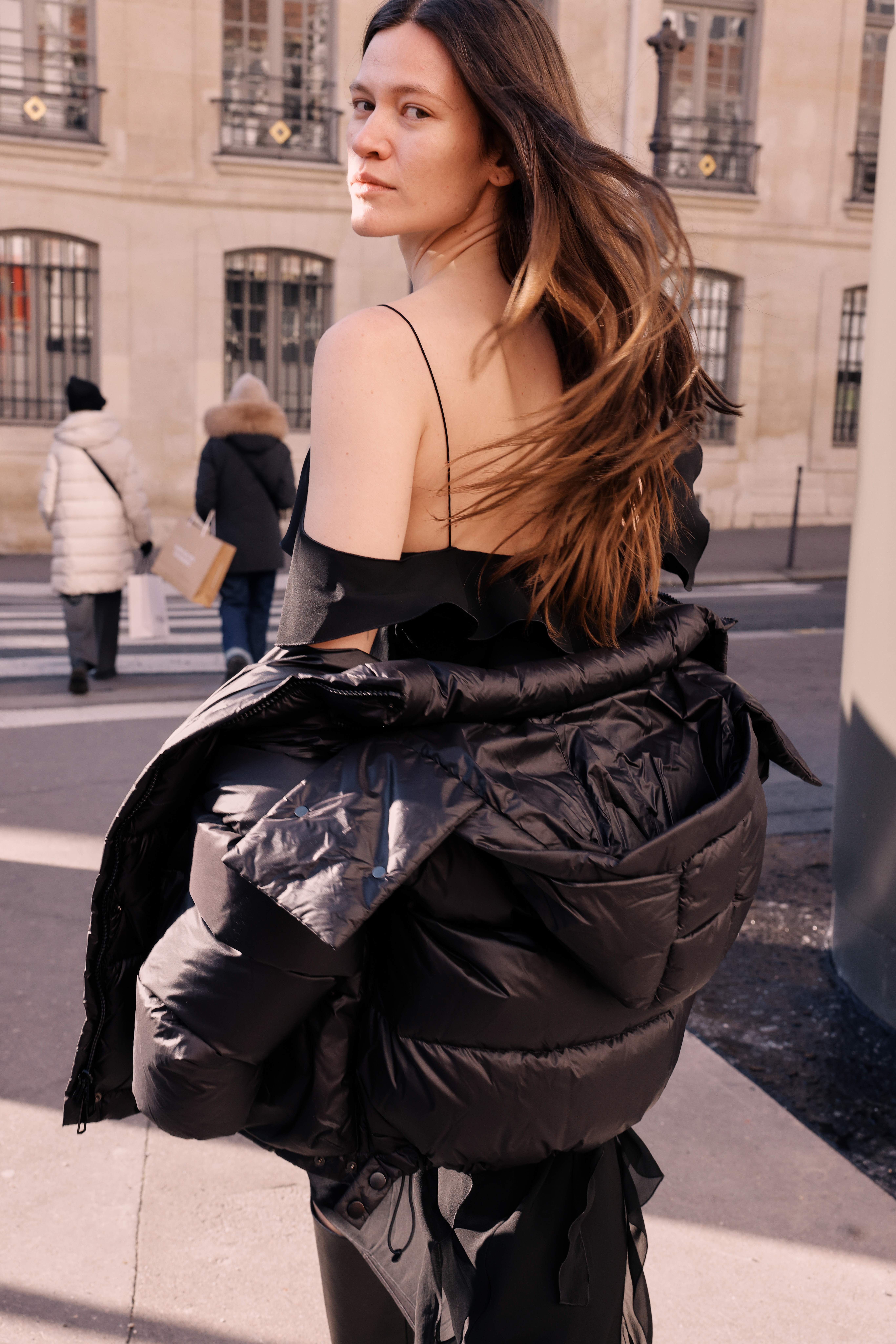 Model with black puffer jacket