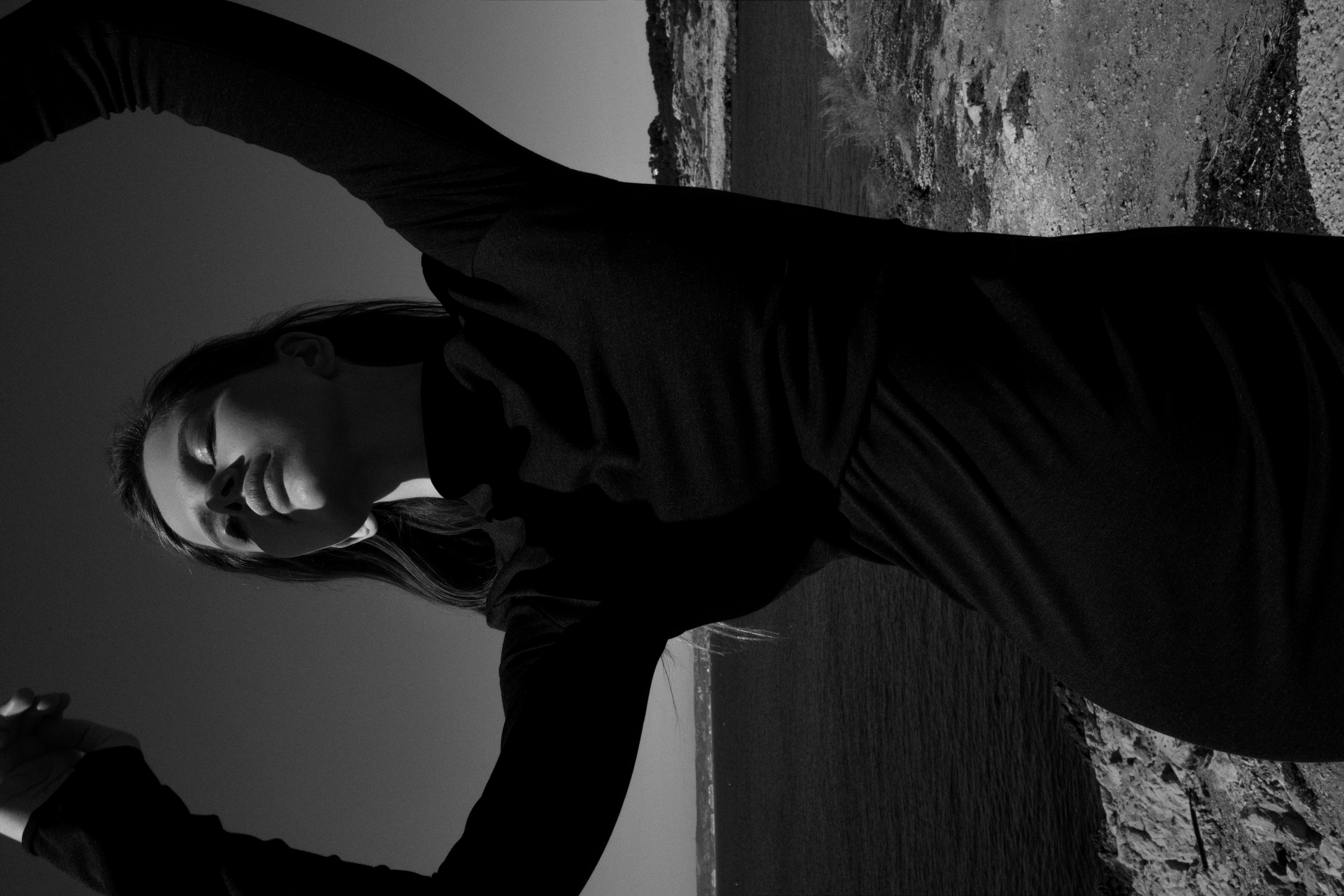 Model with black dress on a beach