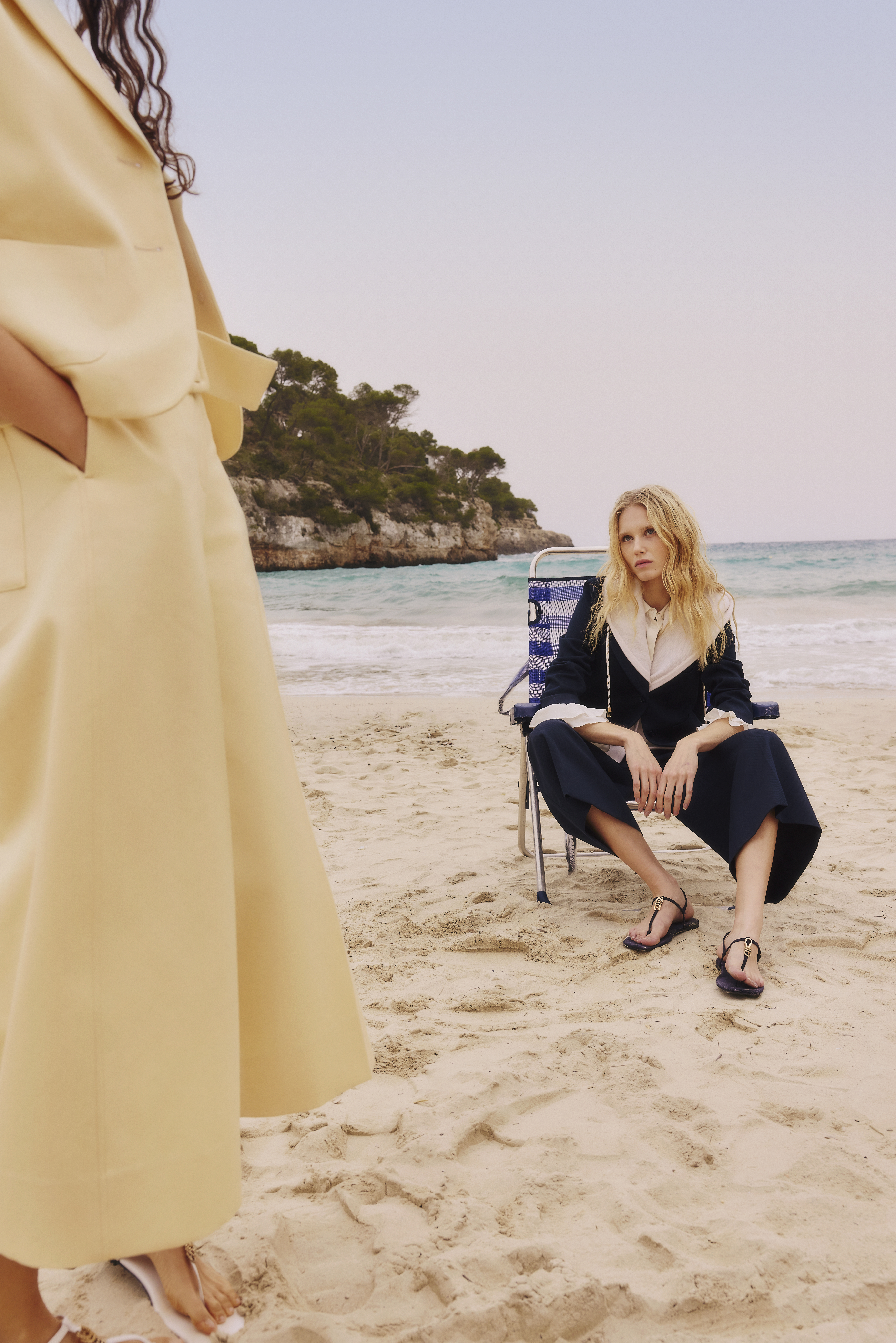 two fashion models posing on sandy beach wearing 261 summer collection