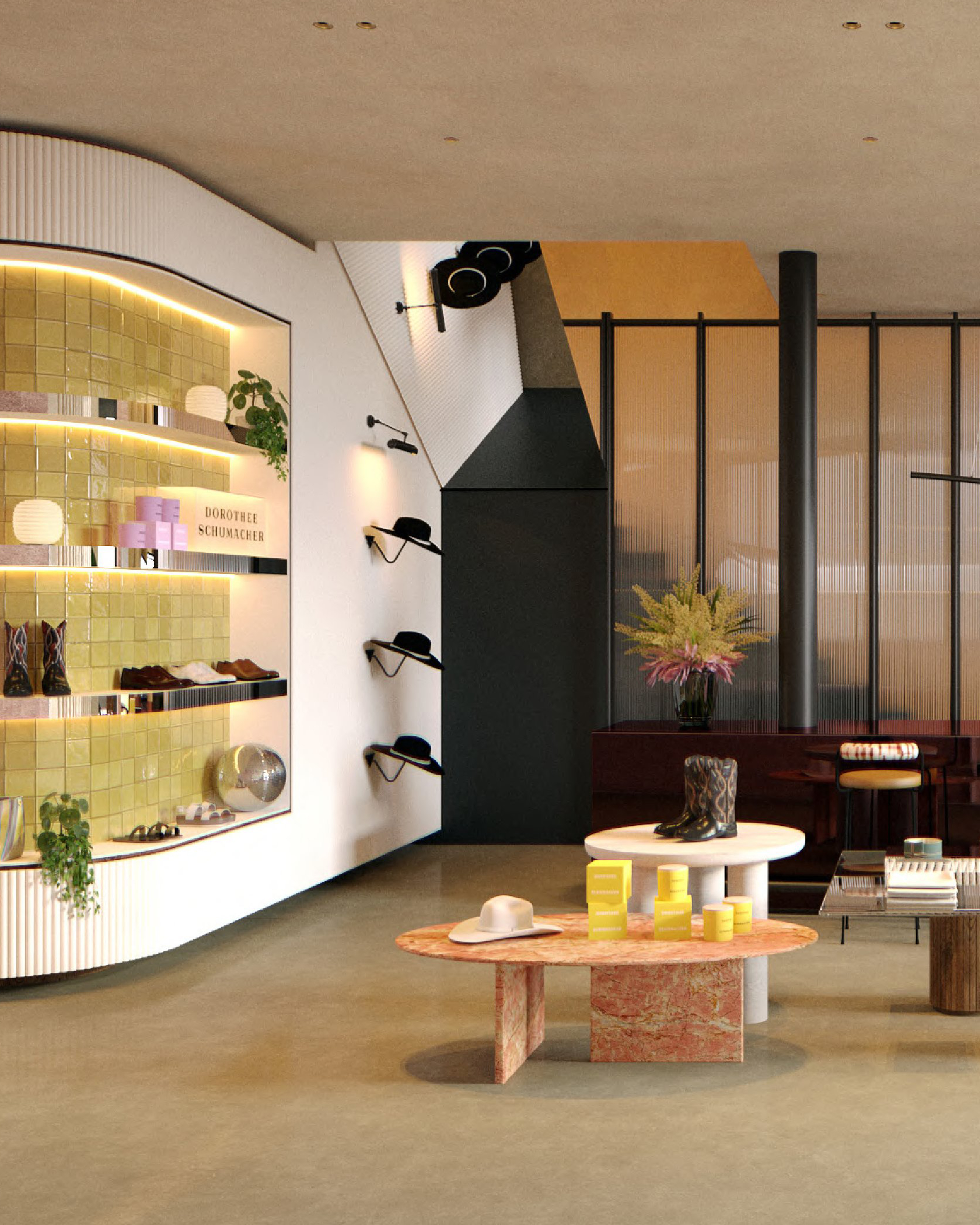 Detailansicht einer beleuchteten Auslage mit gelben Fliesen und Produkten, einer Wand mit Hüten und einem runden Tisch mit Dekoration im Dorothee Schumacher Geschäft.