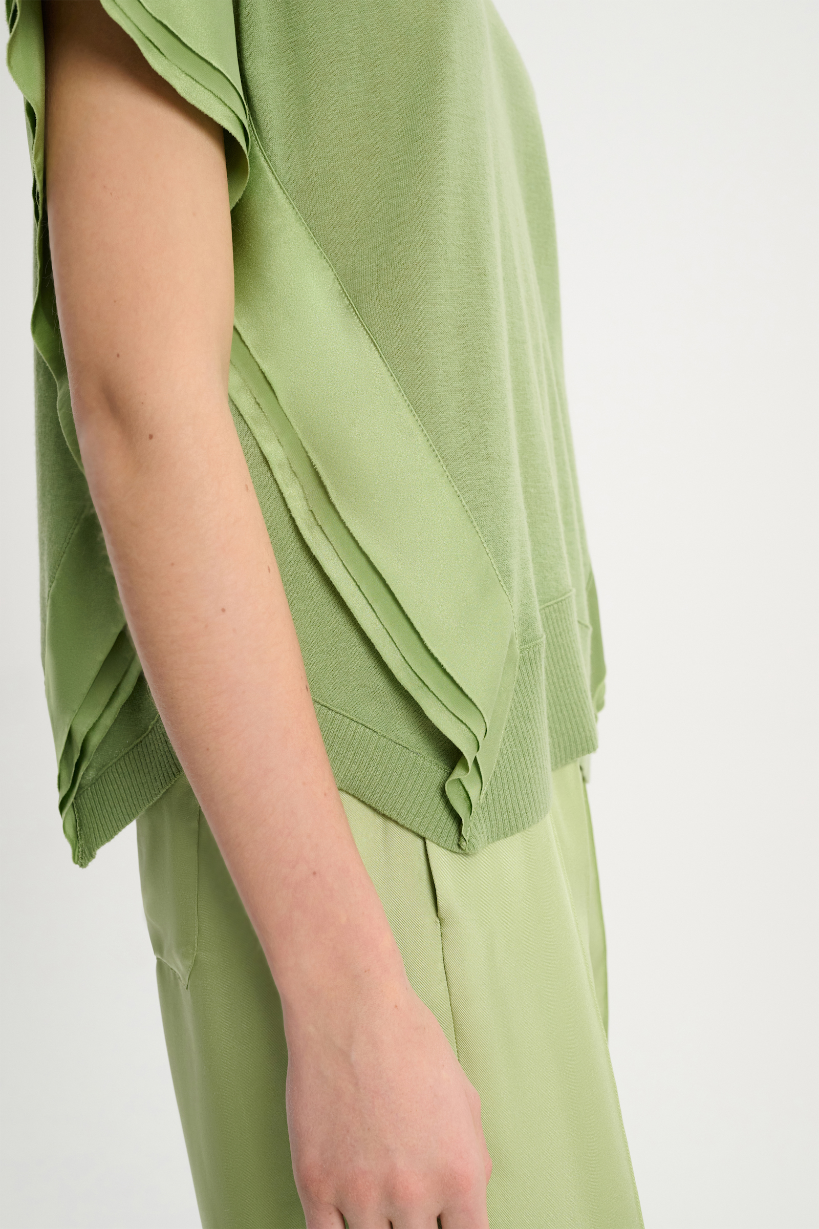 Dorothee Schumacher Wool-cashmere knit top with layered satin trim soft green