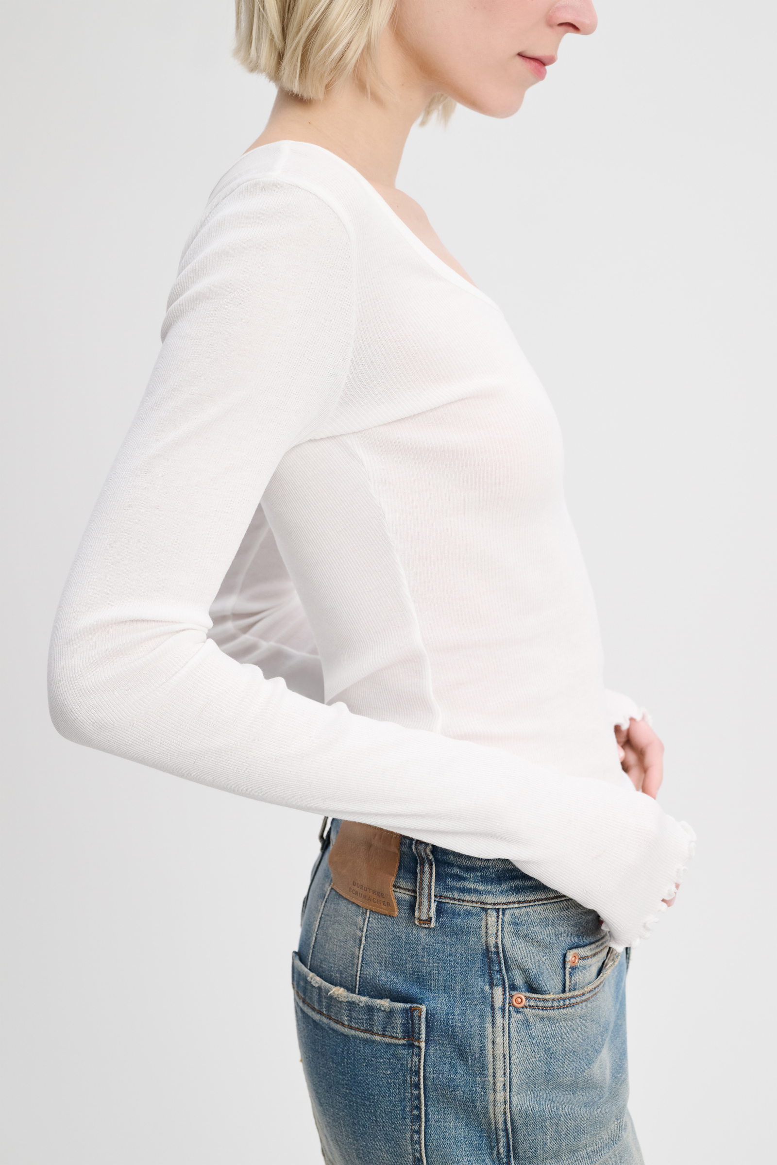 Dorothee Schumacher Ribbed cotton long sleeve top with a deep scoop neckline pure white