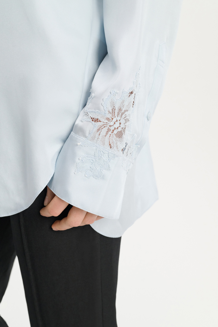 Dorothee Schumacher Silk twill shirt with asymmetric lace inserts on one shoulder and sleeve soft blue