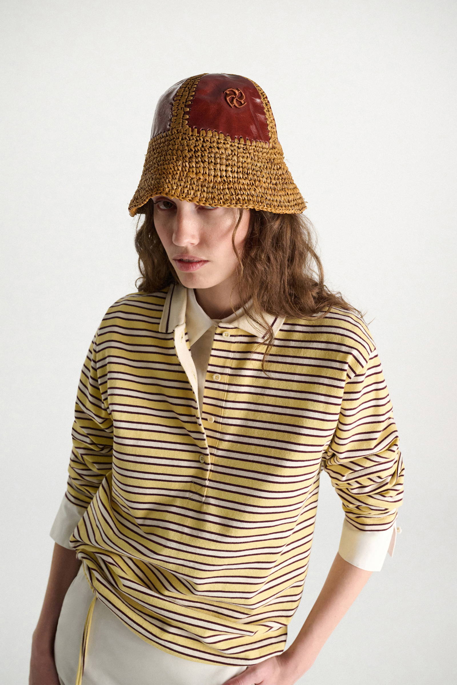 Dorothee Schumacher Crackle patent leather and crochet bucket hat patched raffia