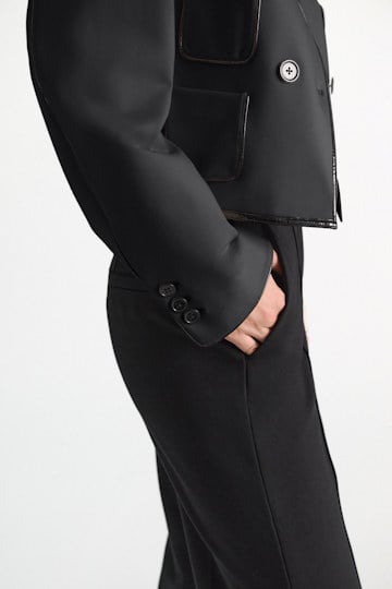Dorothee Schumacher Wide leg pants in Punto Milano with patent vinyl black Model Detail View