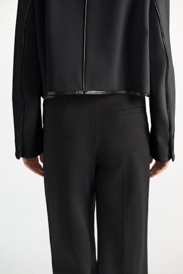 Dorothee Schumacher Wide leg pants in Punto Milano with patent vinyl black Model Detail View