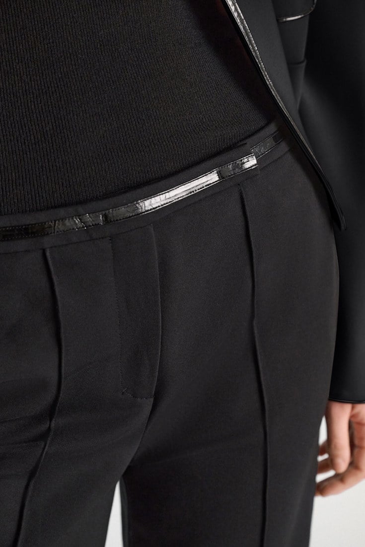 Dorothee Schumacher Wide leg pants in Punto Milano with patent vinyl black Model Detail View