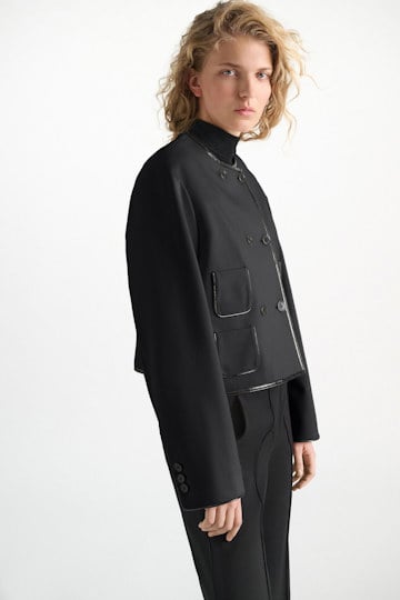 Dorothee Schumacher Cropped jacket in Punto Milano with patent vinyl black Model Detail View