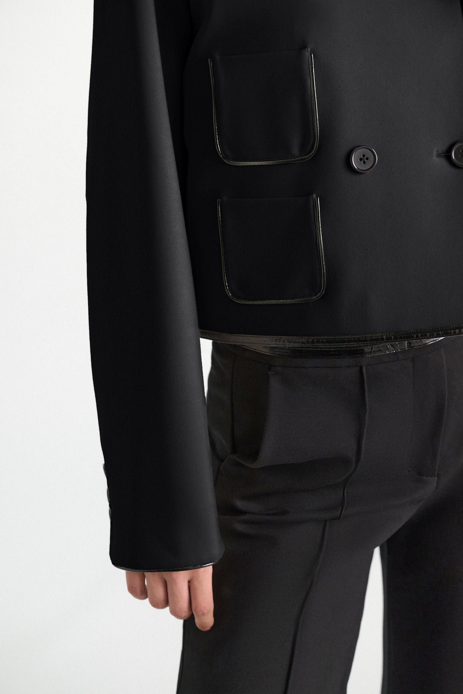 Dorothee Schumacher Cropped jacket in Punto Milano with patent vinyl black Model Detail View