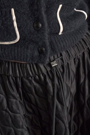 Dorothee Schumacher Quilted skirt in Japanese satin vinyl black Model Detail View