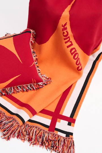 Dorothee Schumacher Wool blanket with GOOD LUCK clover motif orange verde militar mix