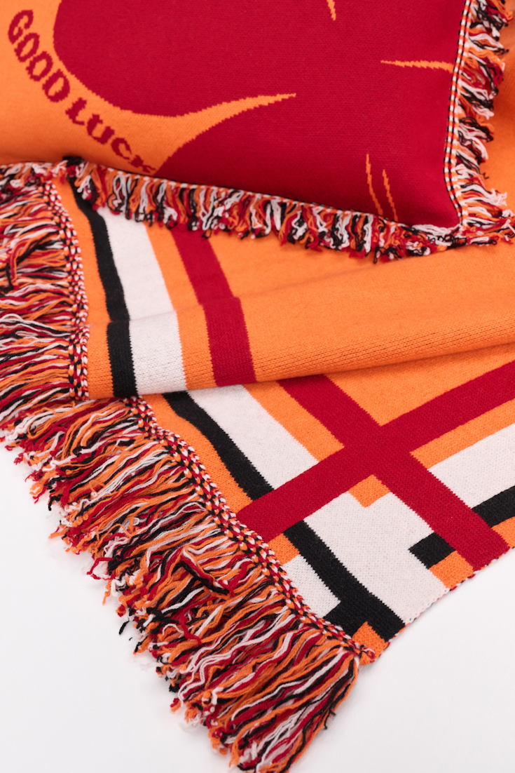 Dorothee Schumacher Wool blanket with GOOD LUCK clover motif orange verde militar mix