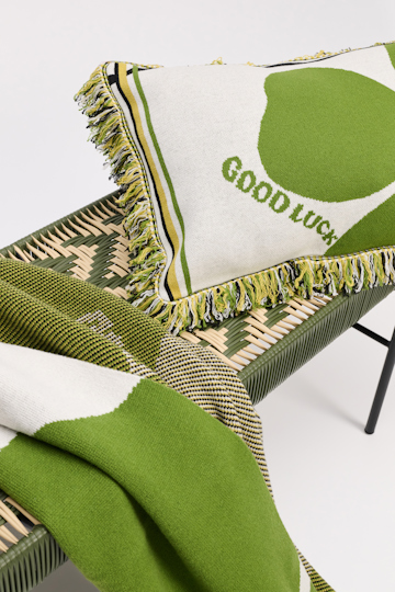 Dorothee Schumacher Wool cushion with GOOD LUCK clover motif marrocan green/white