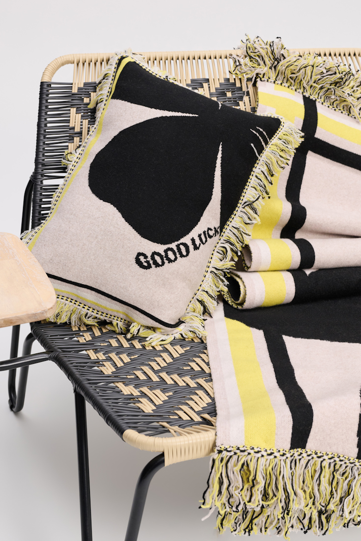 Dorothee Schumacher Wool cushion with GOOD LUCK clover motif beige/black/yellow