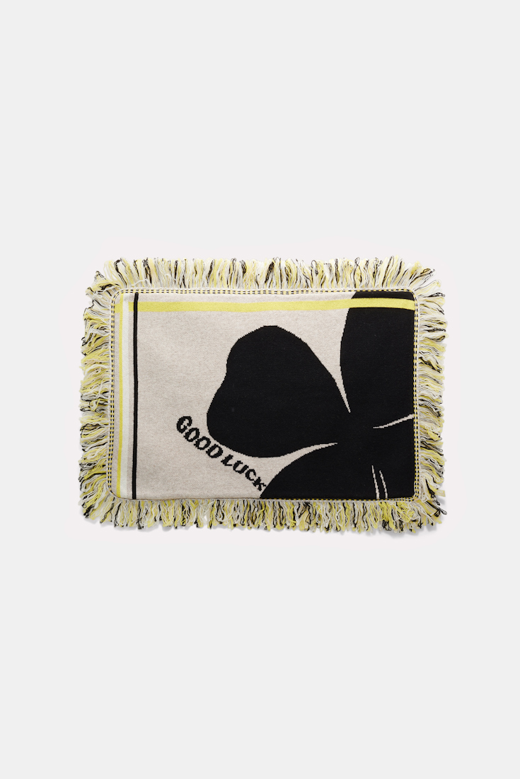 Dorothee Schumacher Wool cushion with GOOD LUCK clover motif beige/black/yellow
