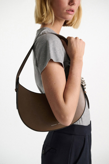 Dorothee Schumacher Half Moon Bag in soft calf leather with D-ring hardware taupe